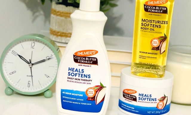 Palmer's Cocoa Butter Formula winter skin care products on vanity table with clock